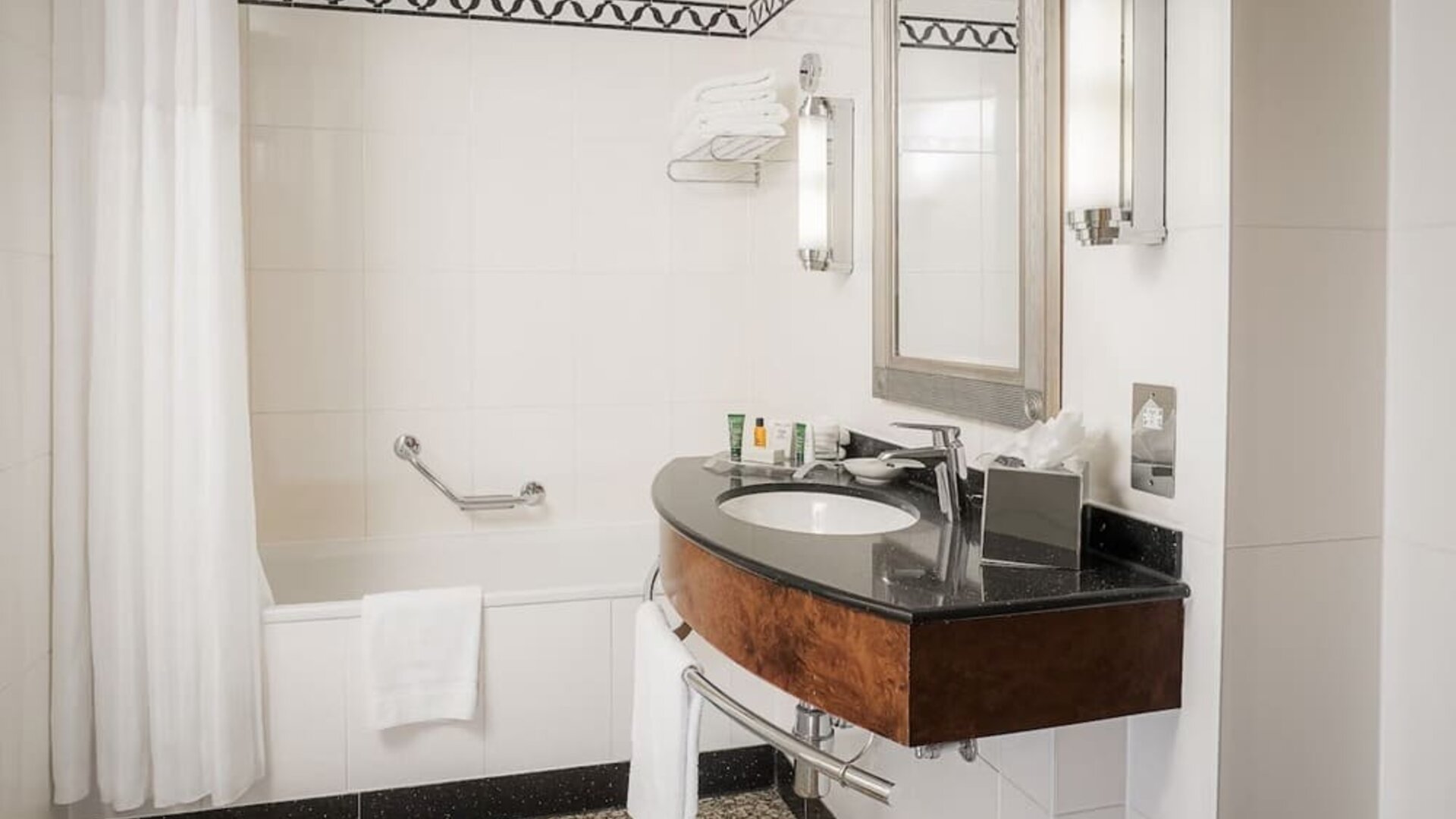 Guest bathroom with shower at Hilton London Paddington.