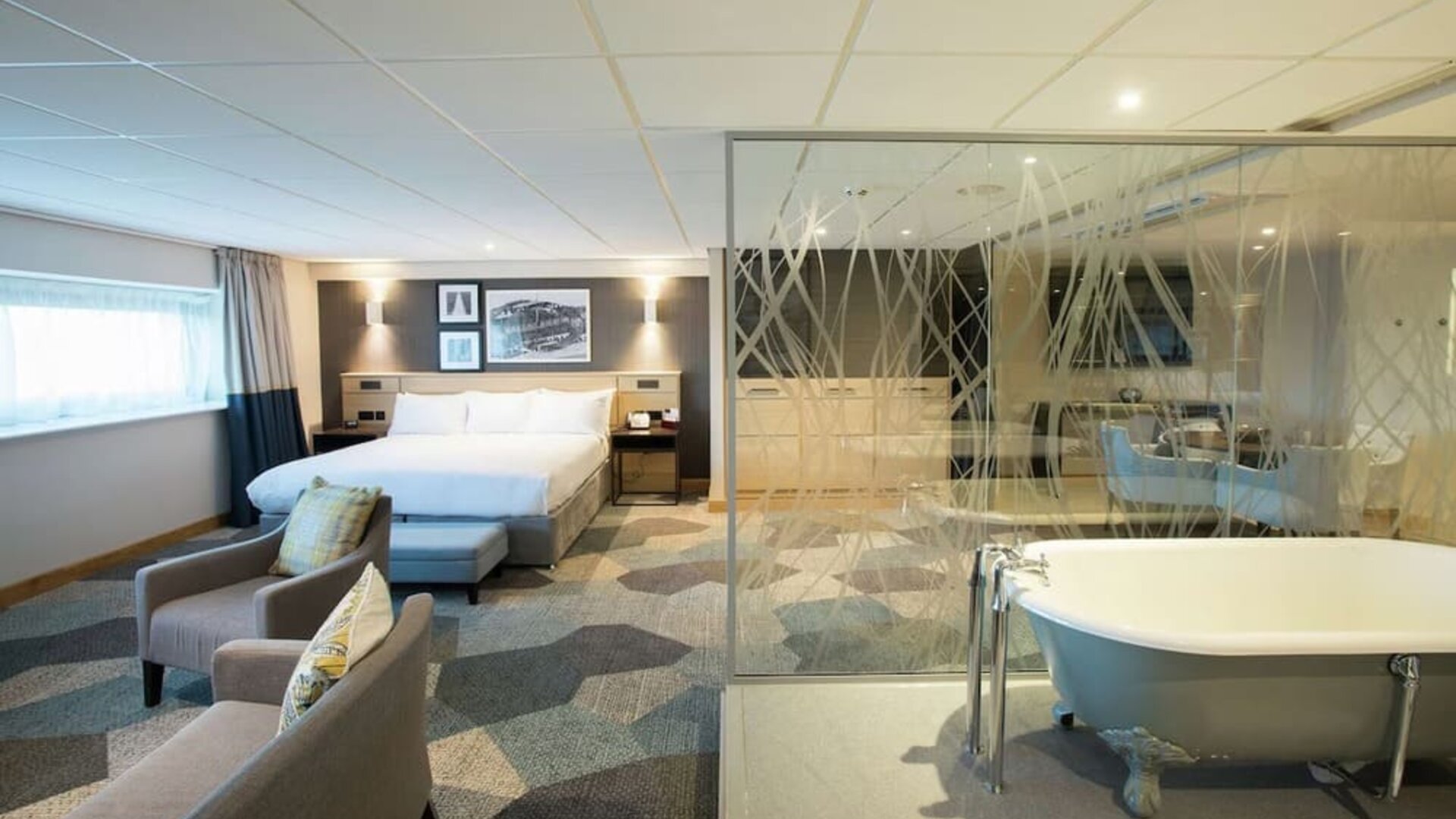 Spacious day use room with living area and tub at DoubleTree By Hilton Coventry Building Society Arena.