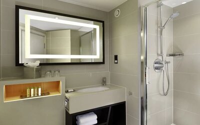 Guest bathroom with shower at DoubleTree By Hilton London - Ealing.