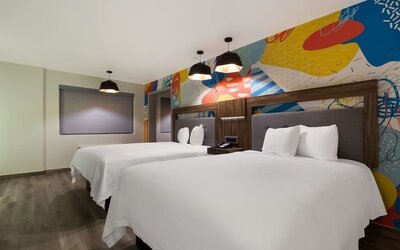 Day use room with queen beds at Signature Inn Houston Galleria.