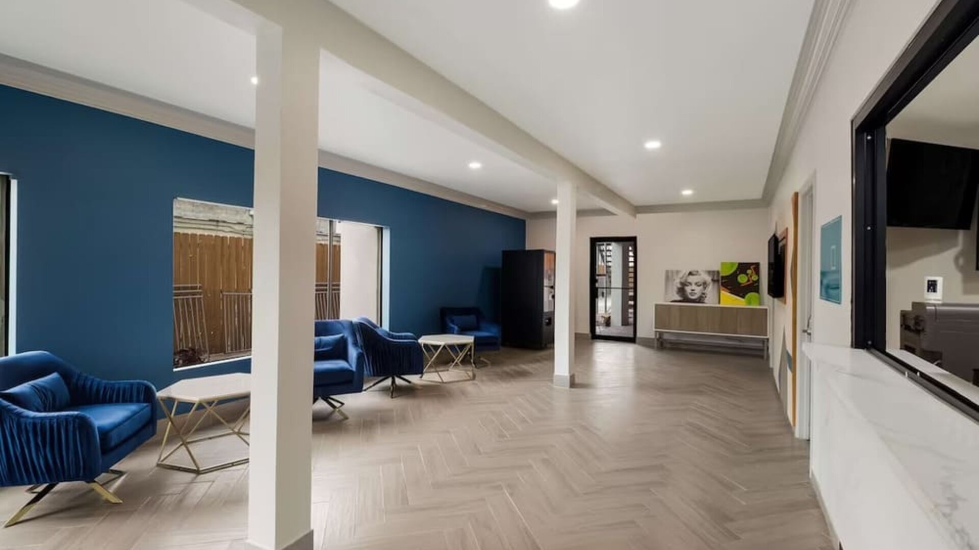 Lobby and coworking space at Signature Inn Houston Galleria.