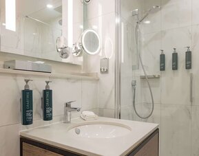 Guest bathroom with shower at DoubleTree By Hilton Manchester Airport.