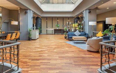 Lobby and coworking lounge at Hilton London Kensington.
