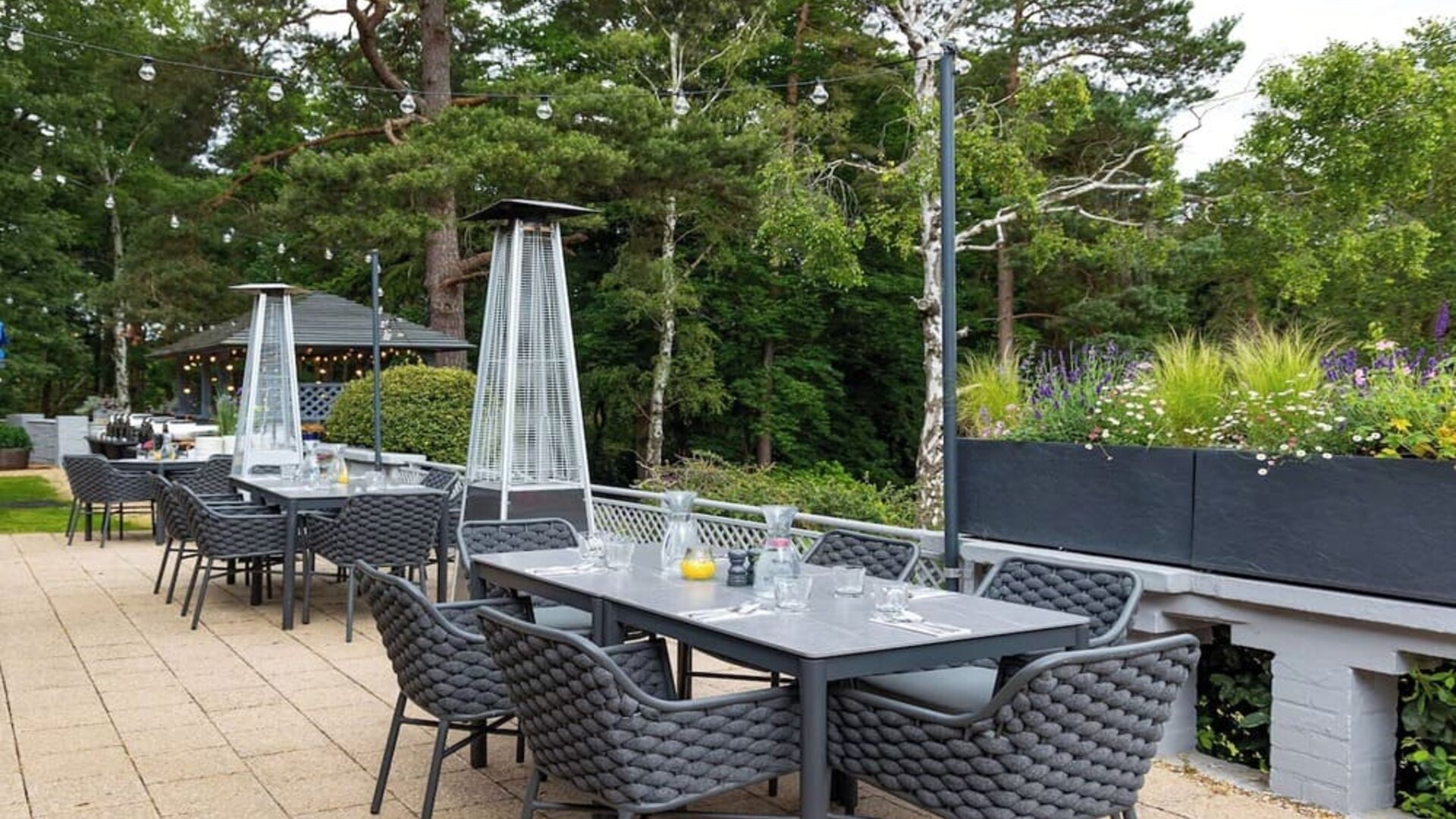 Outdoor dining area at Hilton Cobham.