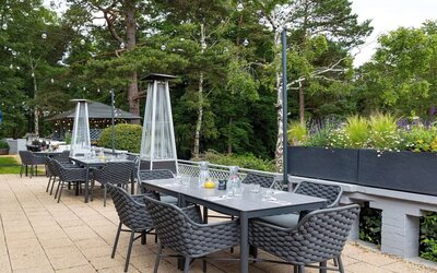 Outdoor dining area at Hilton Cobham.