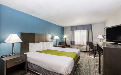 Romantic king room with TV at Baymont By Wyndham Pella.