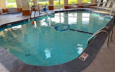 Indoor pool with natural light at Baymont By Wyndham Pella.