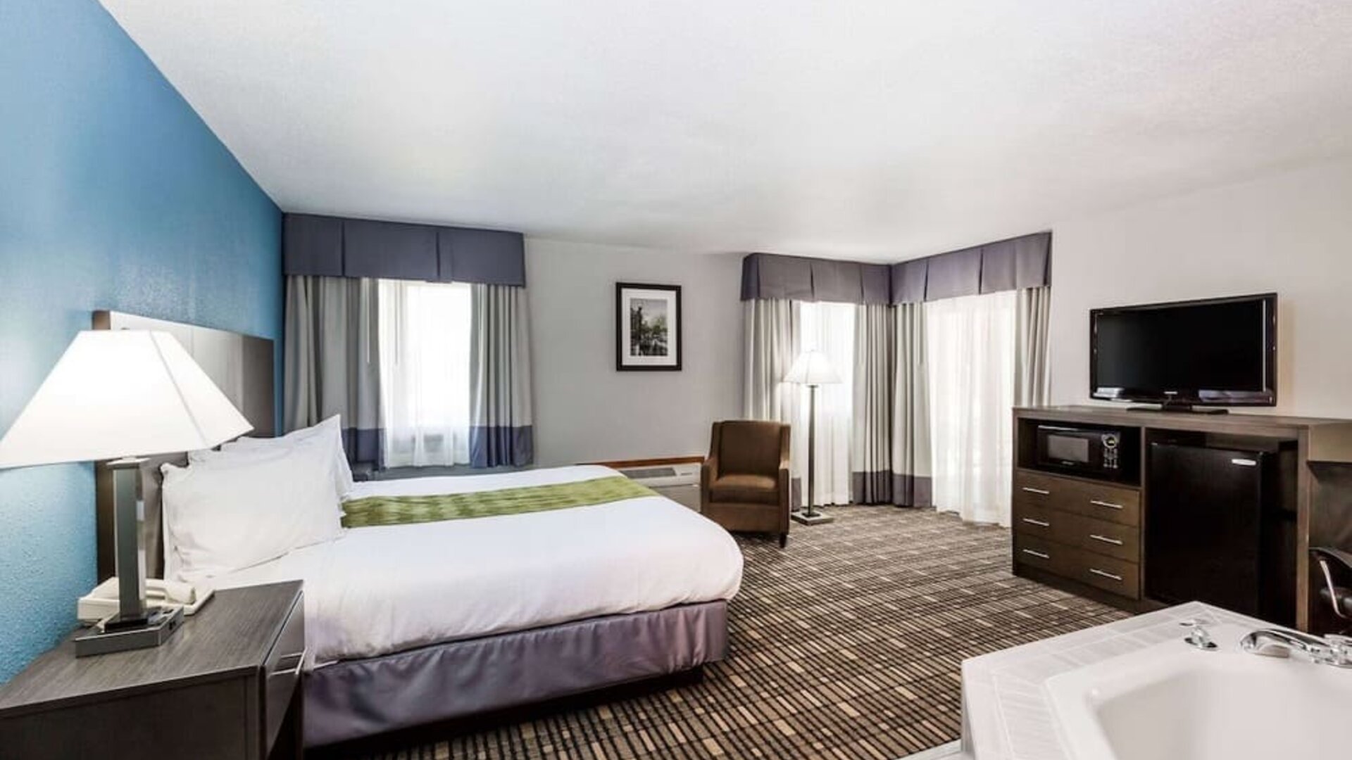 King room with natural light at Baymont By Wyndham Pella.