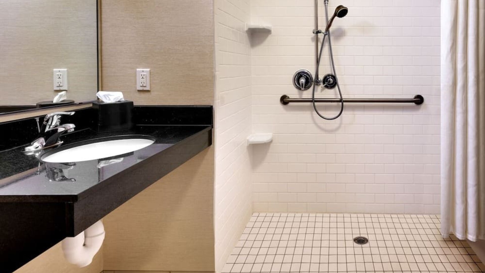 Guest bathroom with shower at Fairfield Inn & Suites By Marriott Tallahassee Central.