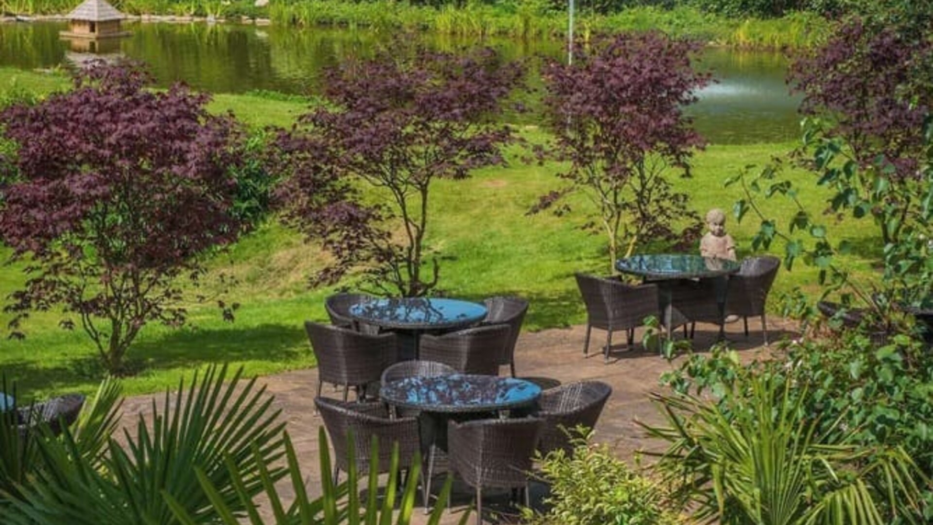 Outdoor seating and natural scenery at DoubleTree By Hilton Bristol South - Cadbury House.
