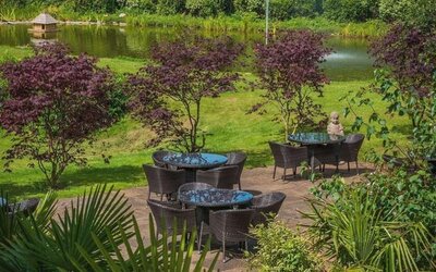 Outdoor seating and natural scenery at DoubleTree By Hilton Bristol South - Cadbury House.