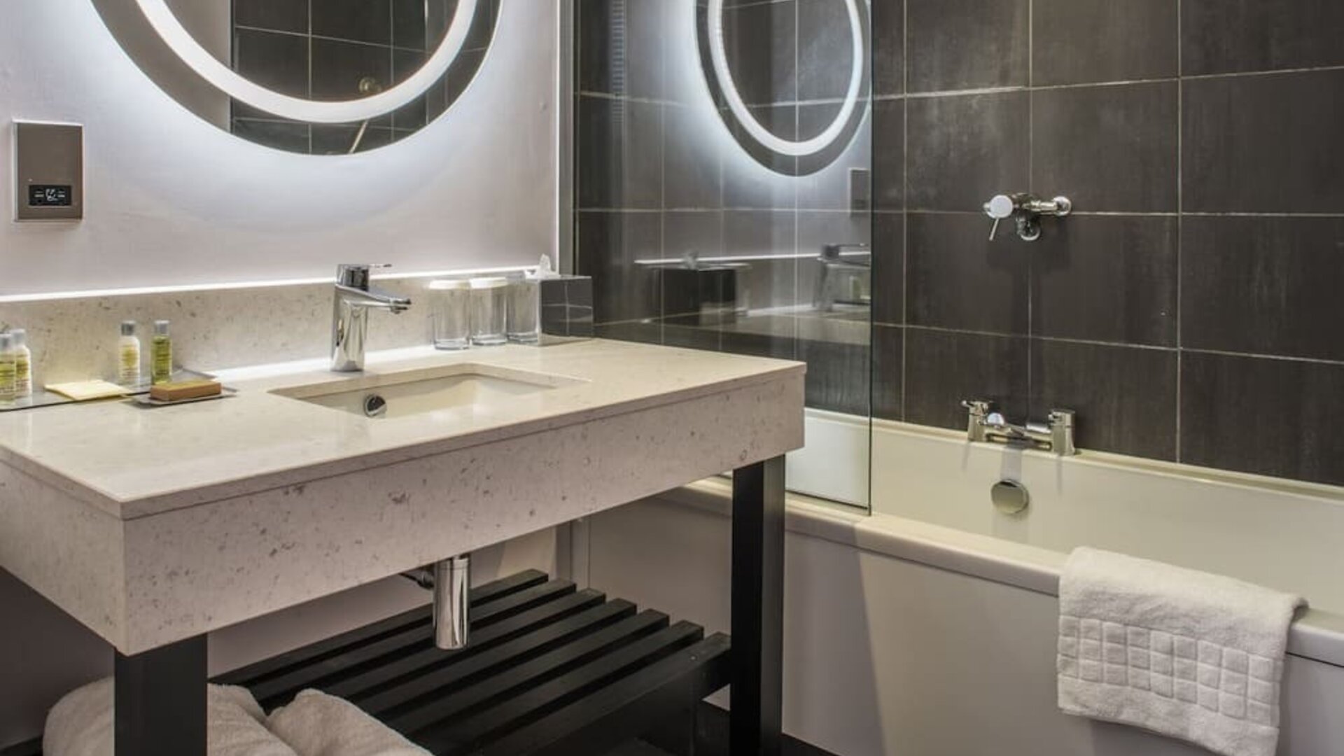 Guest bathroom with shower and tub at DoubleTree By Hilton Bristol South - Cadbury House.