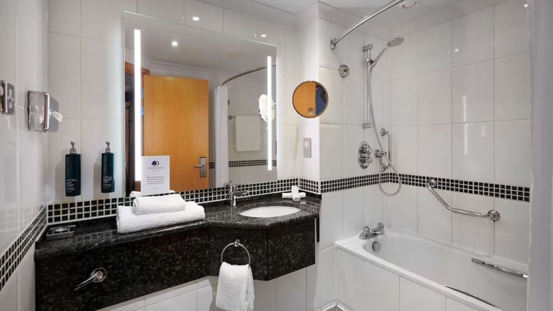 Guest bathroom with shower at DoubleTree by Hilton Swindon.