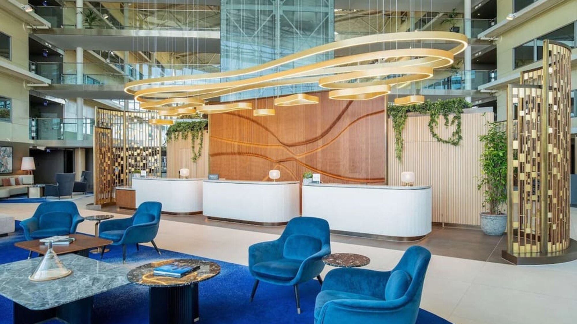 Stylish lobby and coworking lounge at Hilton London Heathrow Airport.