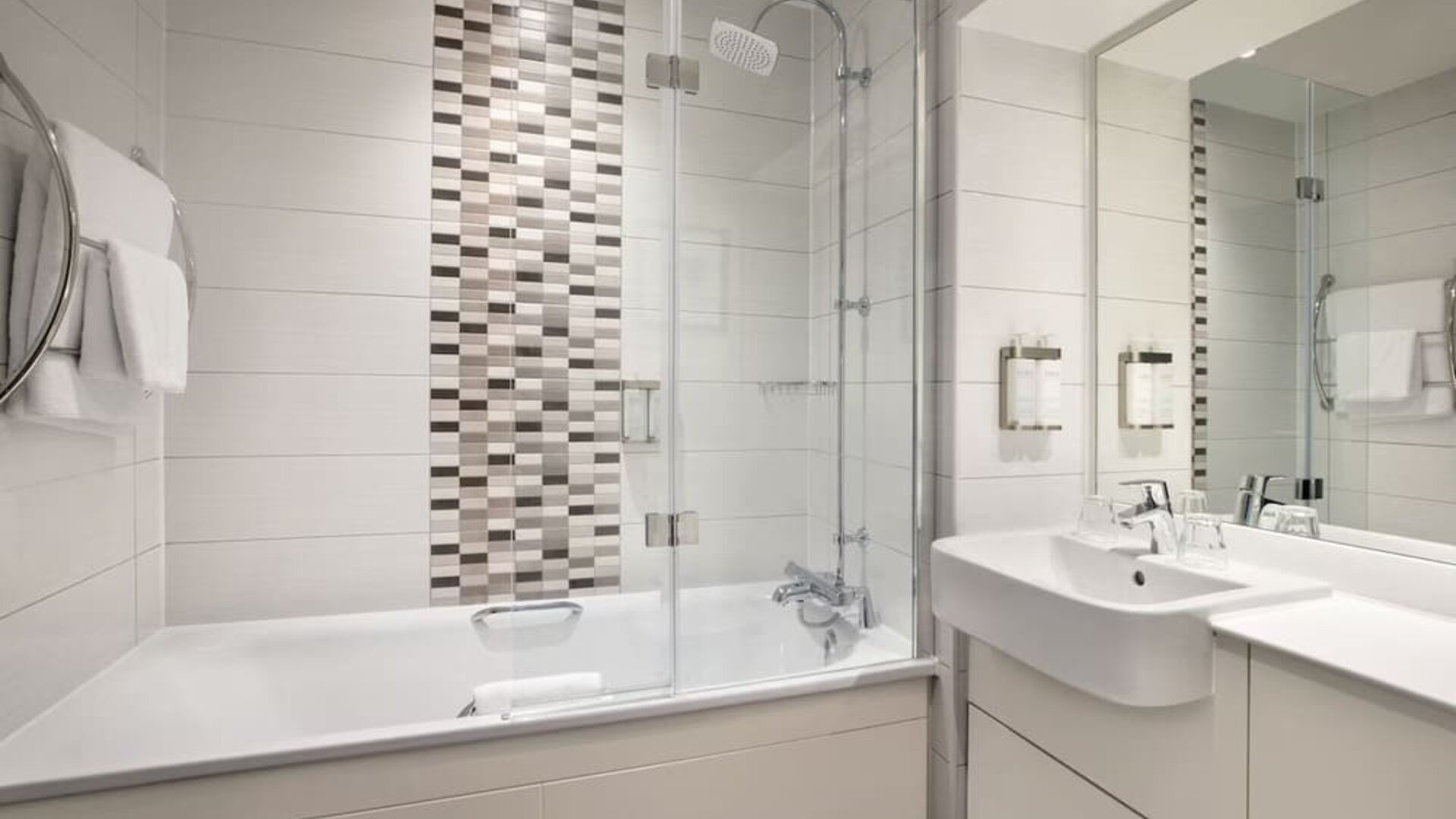 Guest bathroom with shower and tub at Leonardo Hotel Chester.