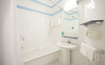 Guest bathroom with shower at Leonardo Hotel Leeds.