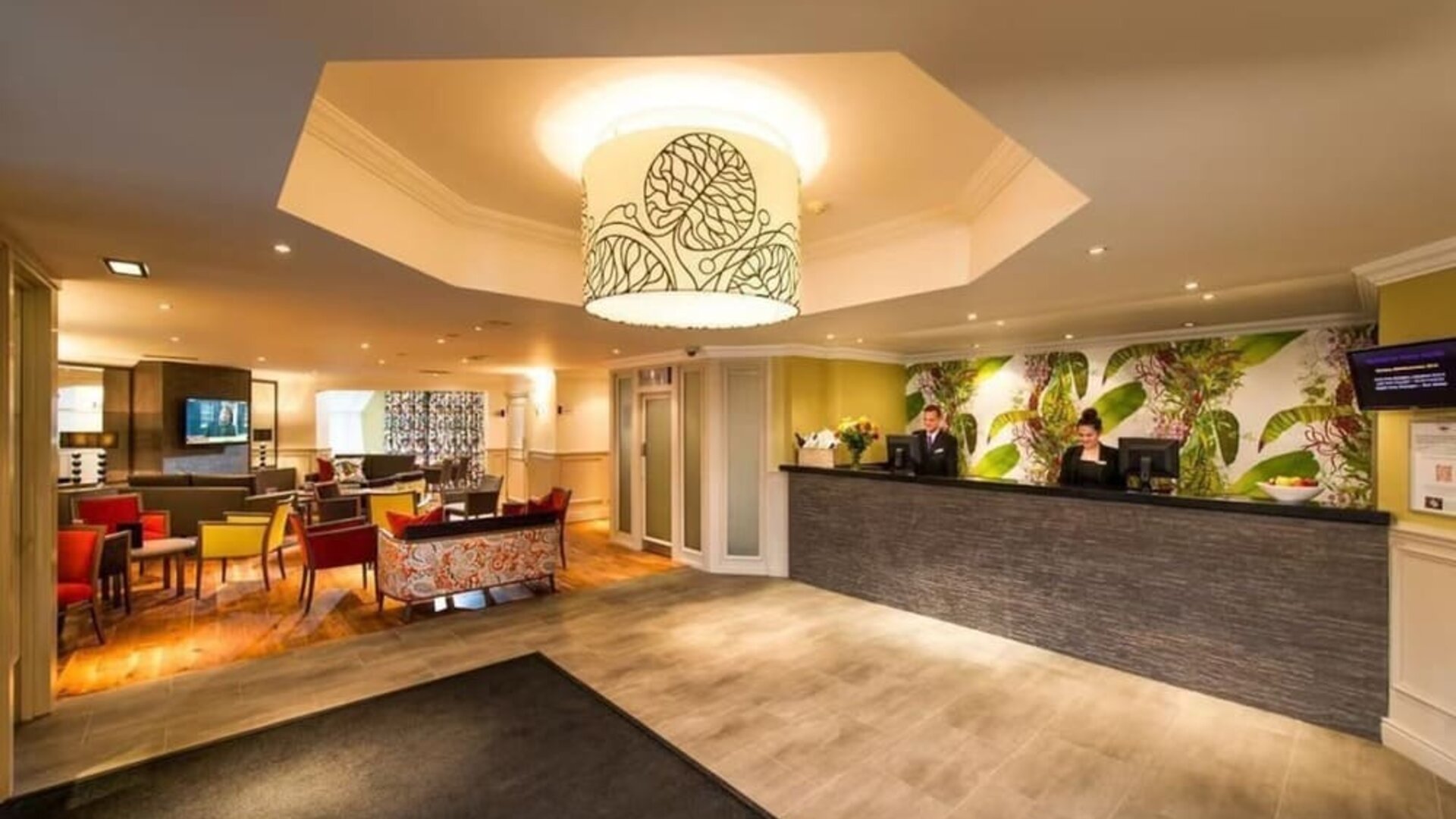 Reception and coworking lounge at Leonardo Inn Glasgow West End. 