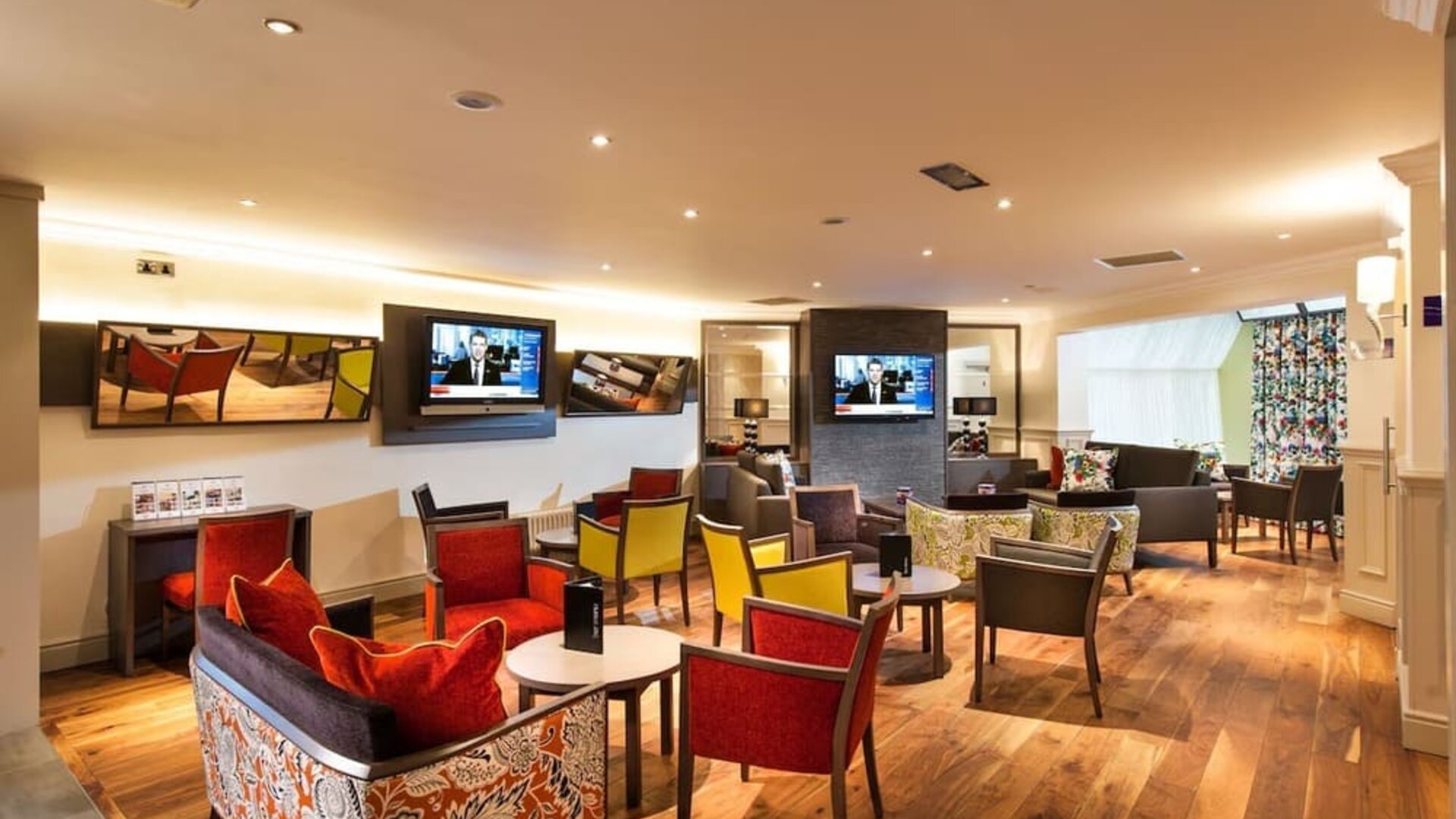 Lobby and coworking lounge at Leonardo Inn Glasgow West End. 