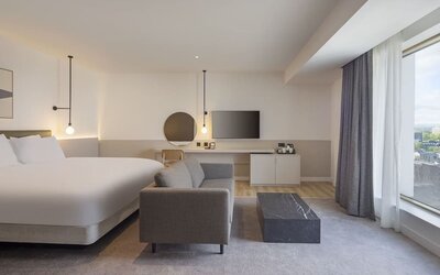 Spacious day use room with sofa at Leonardo Hotel Manchester Piccadilly. 