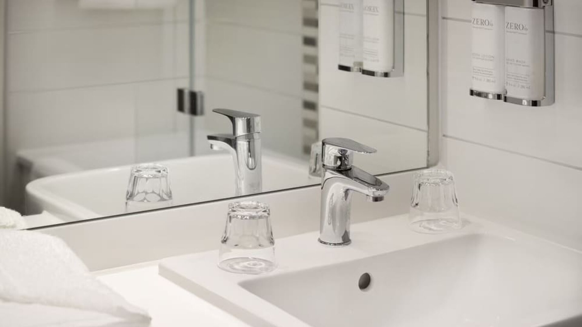 Guest bathroom with shower at Leonardo Hotel Manchester Piccadilly. 