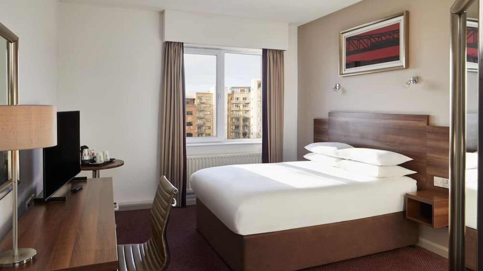 King bed with natural light at Leonardo Hotel Newcastle.