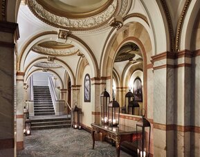Ornate hotel hallway with arched ceilings and marble accents at The Midland - A Leonardo Royal Hotel.
