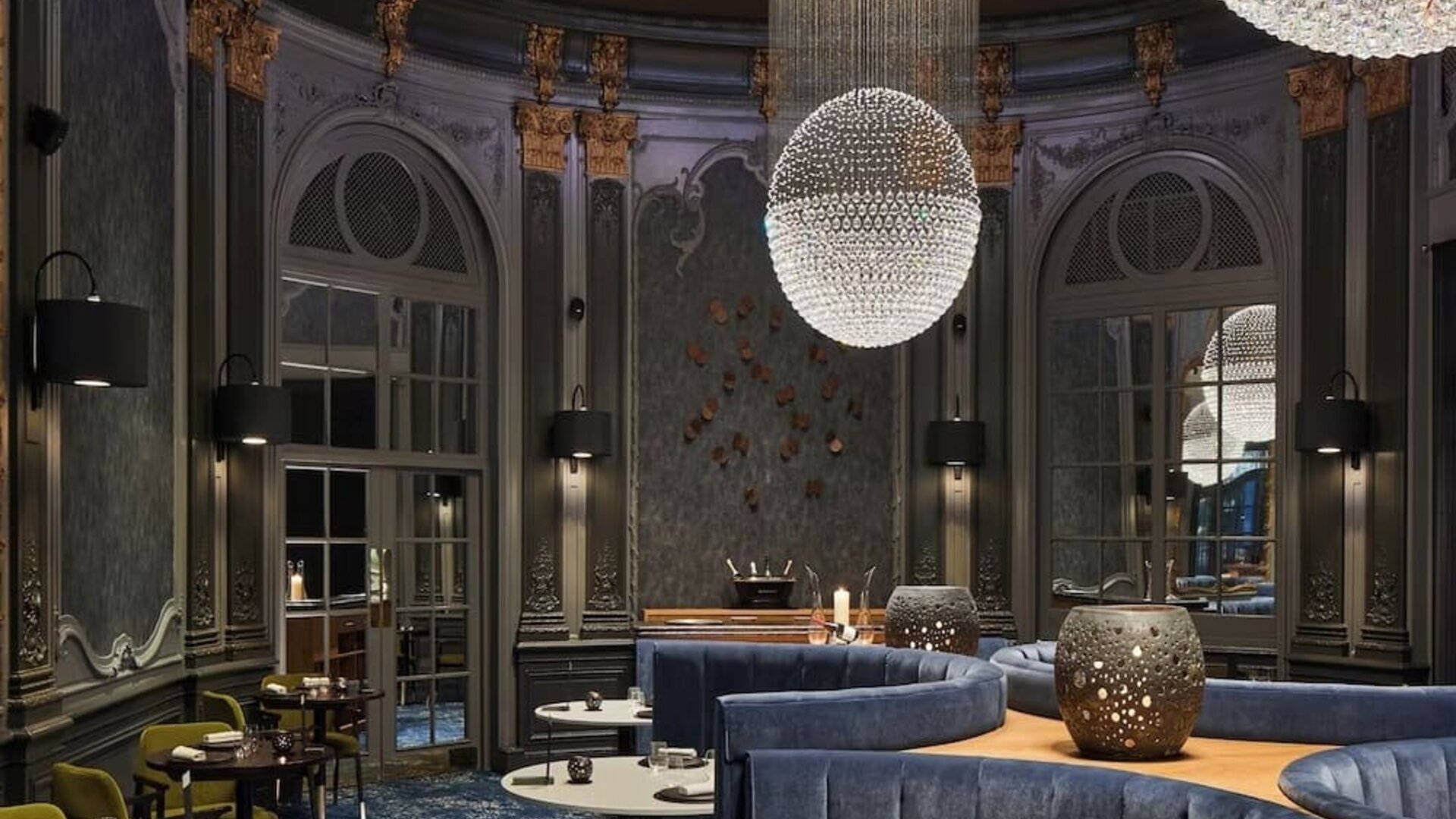 Intimate dining area with luxurious chandeliers at The Midland - A Leonardo Royal Hotel.