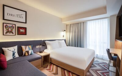 Day use room with sofa and work desk at Hampton By Hilton London City.