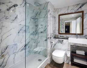 Guest bathroom with shower at DoubleTree By Hilton London Excel.
