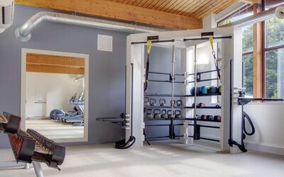 Fitness center with treadmills, machines and equipment at Hilton London Watford.