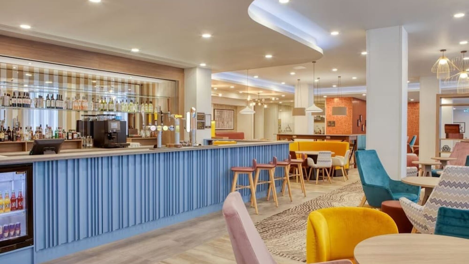 Hotel bar and lounge area at the Hampton by Hilton Manchester Northern Quarter.