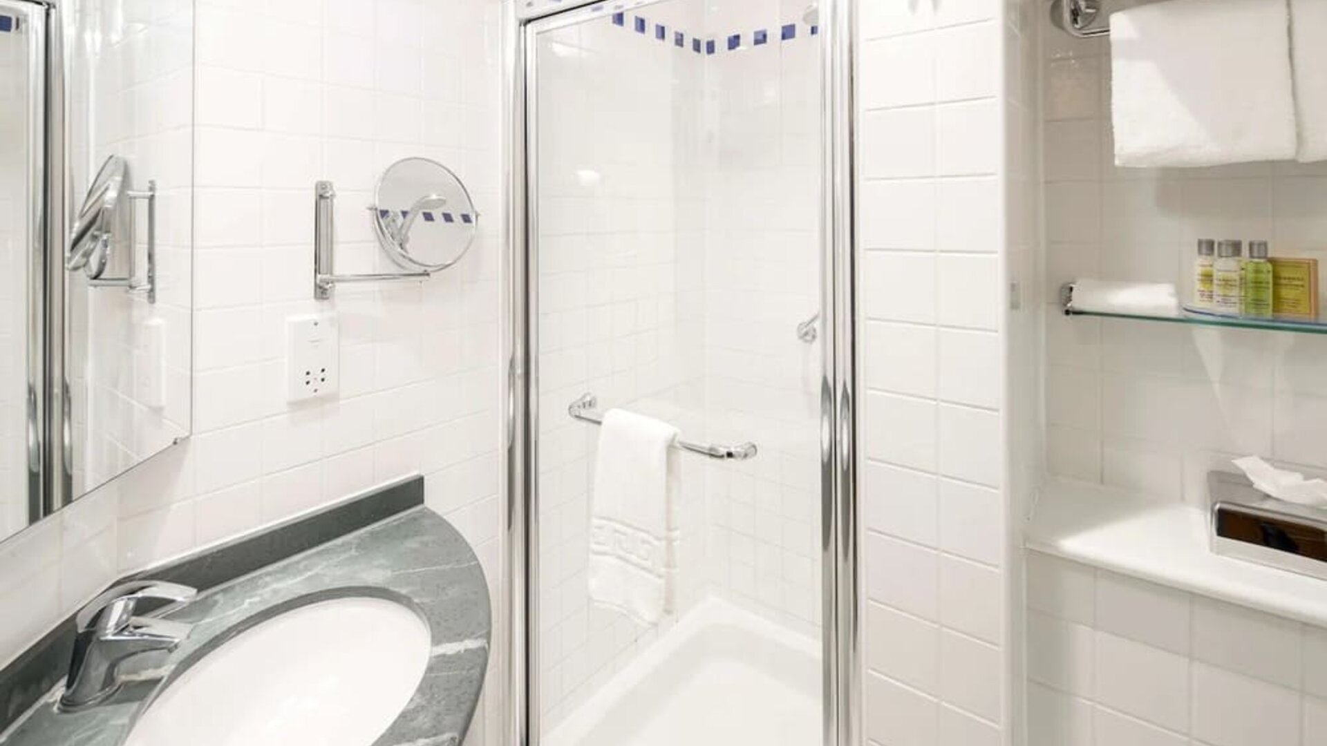 Guest bathroom with shower at Hilton Garden Inn Bristol City Centre.