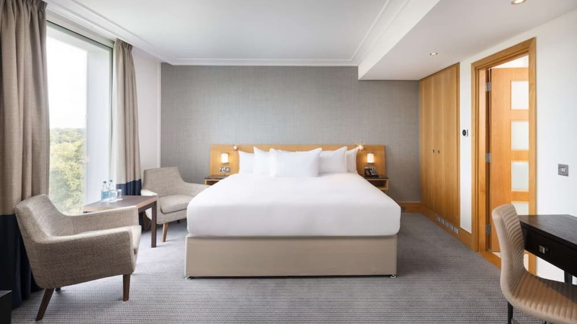 Day use guestroom with work desk and lounge area at the Hilton London Gatwick Airport.