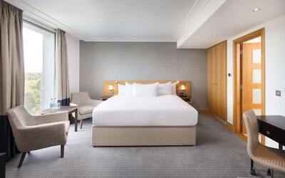 Day use guestroom with work desk and lounge area at the Hilton London Gatwick Airport.