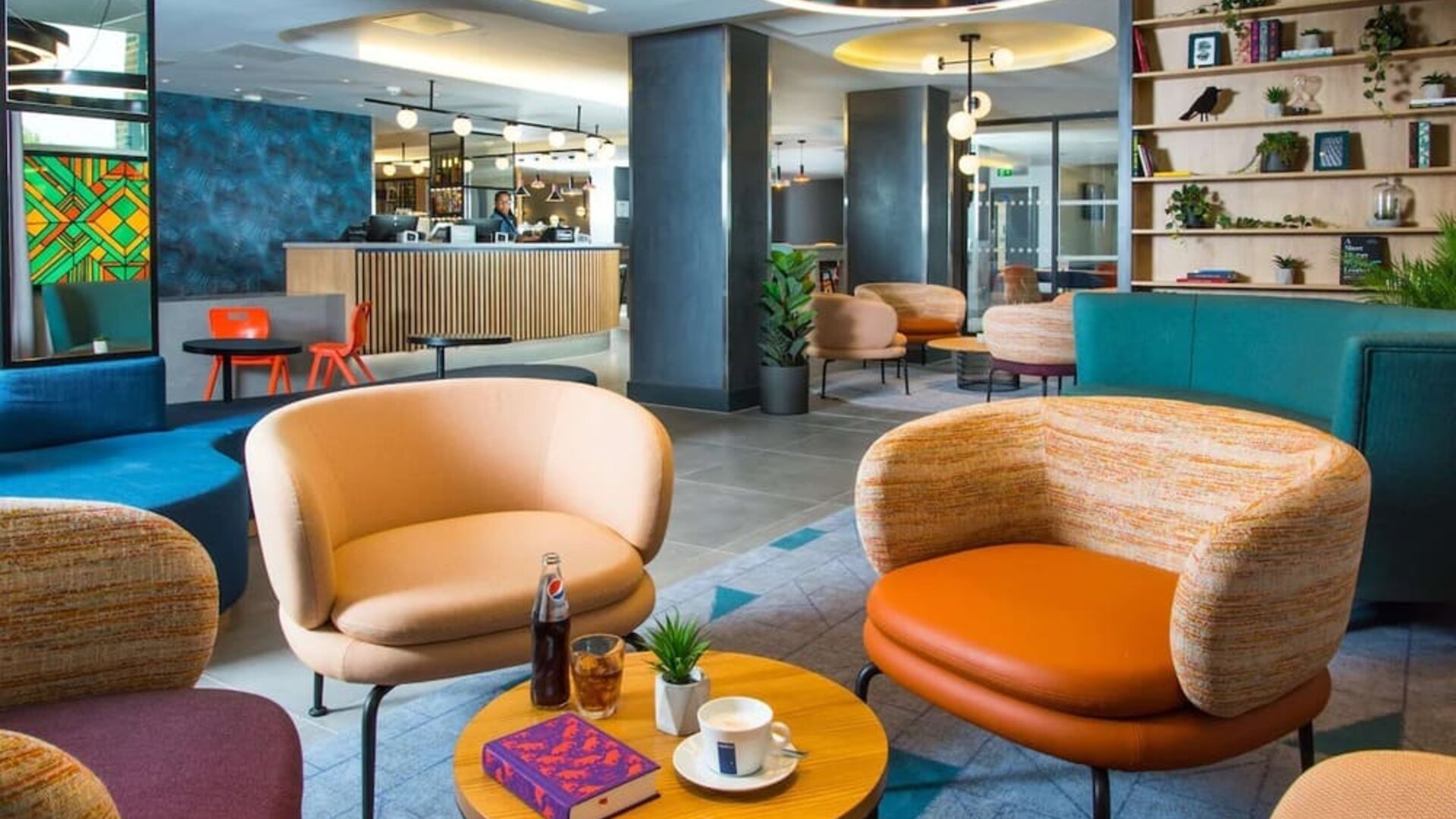 Lobby and coworking lounge at Hampton By Hilton London Park Royal.