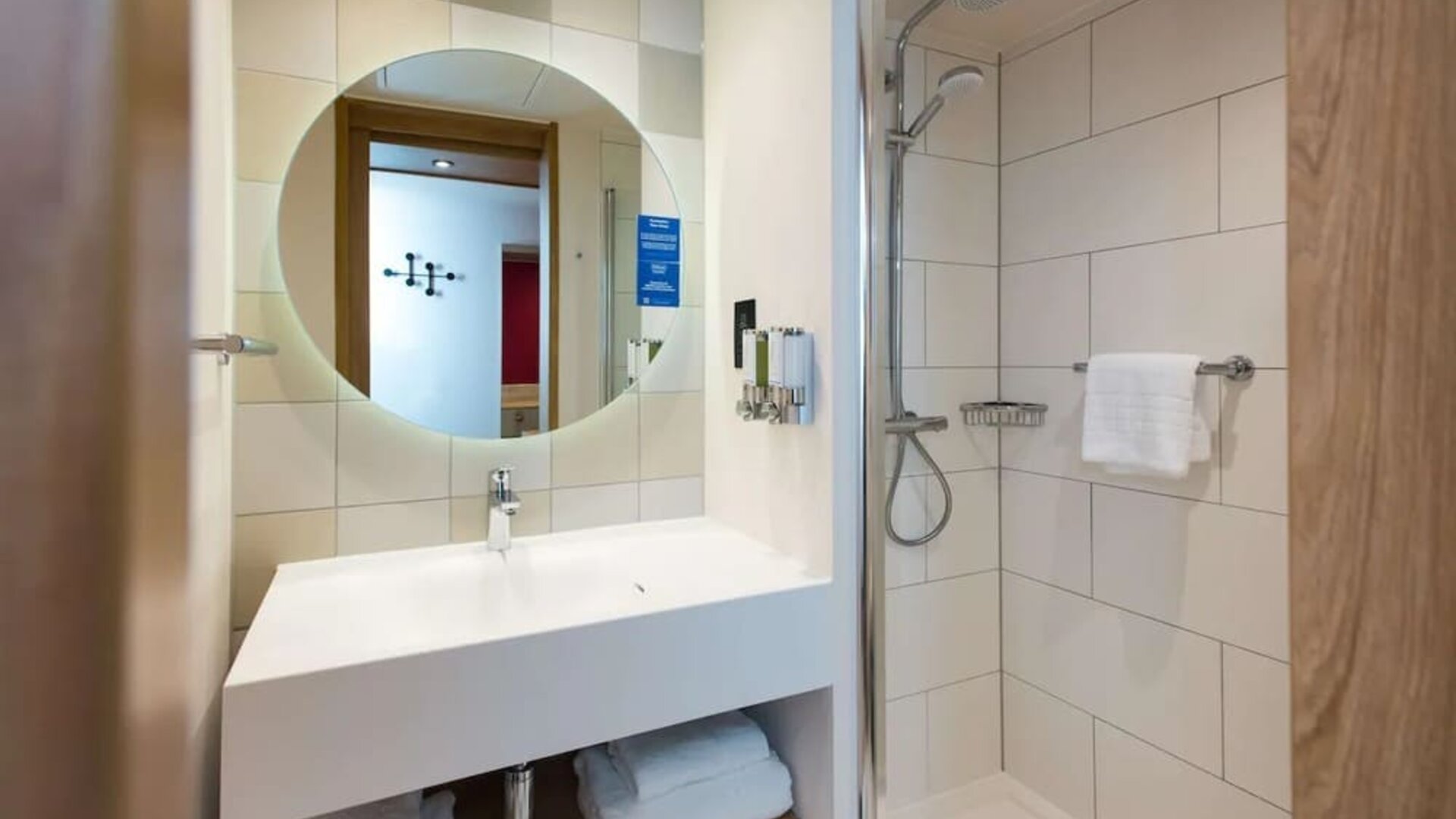 Guest bathroom with shower at Hampton By Hilton London Park Royal.