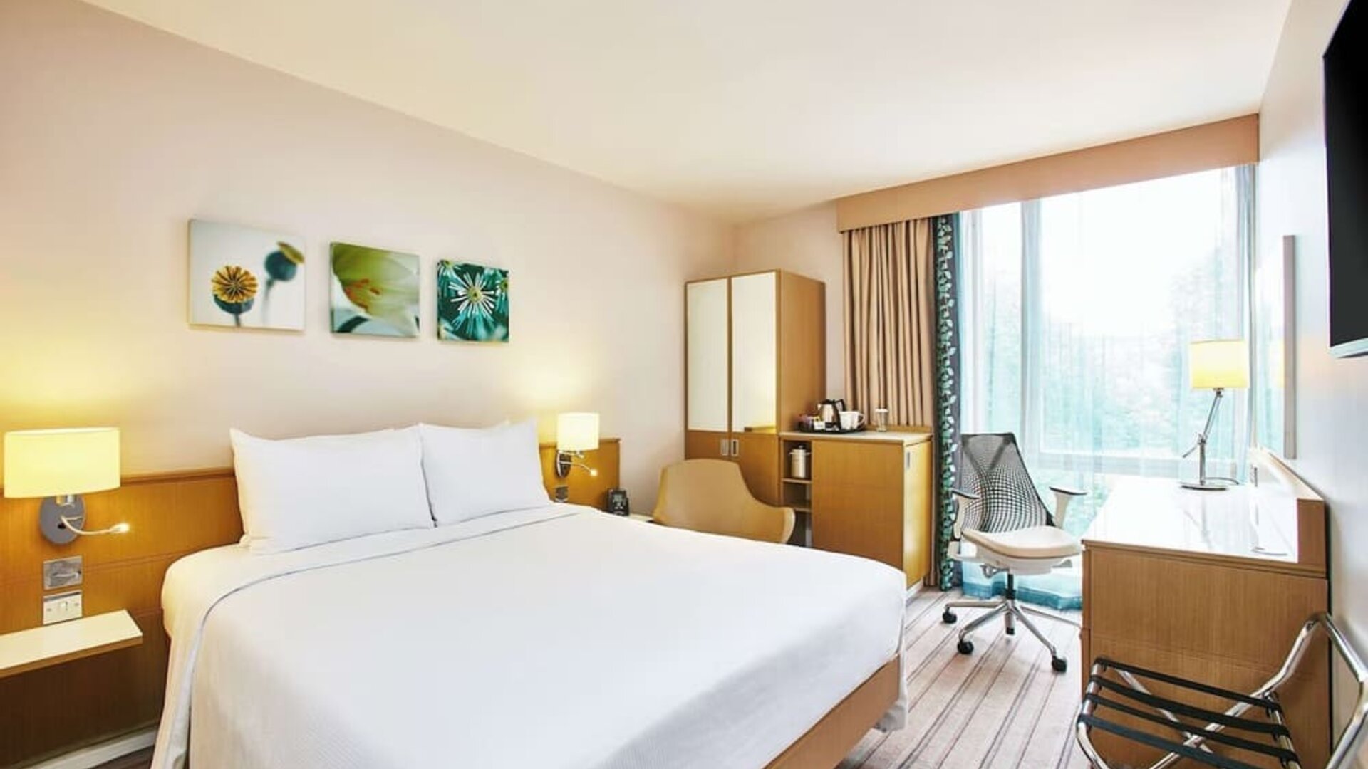 Bright hotel room with working station at the Hilton Garden Inn Birmingham Brindleyplace.