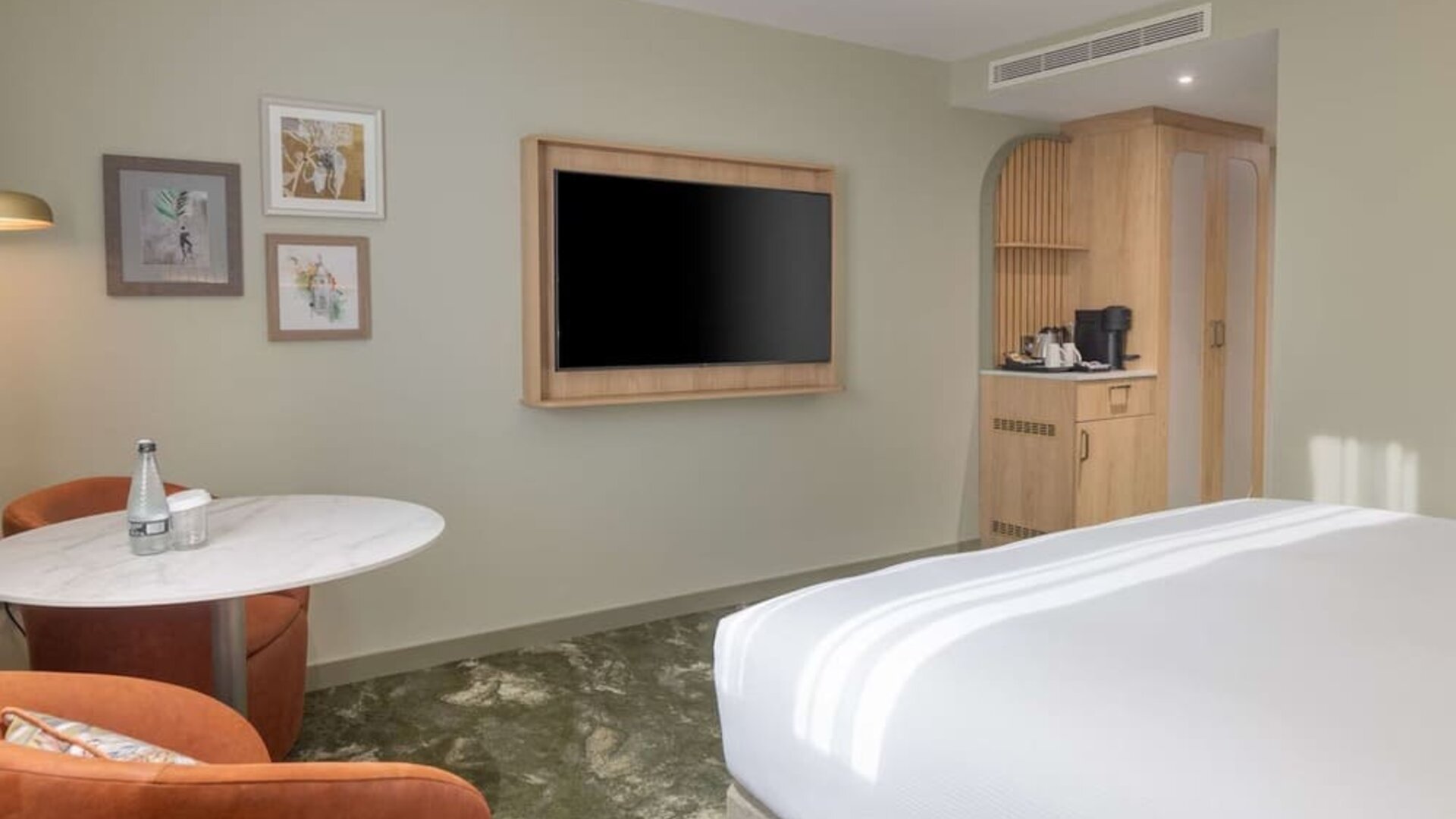 Day use guest room with lounge area and TV at the DoubleTree by Hilton Bristol North.
