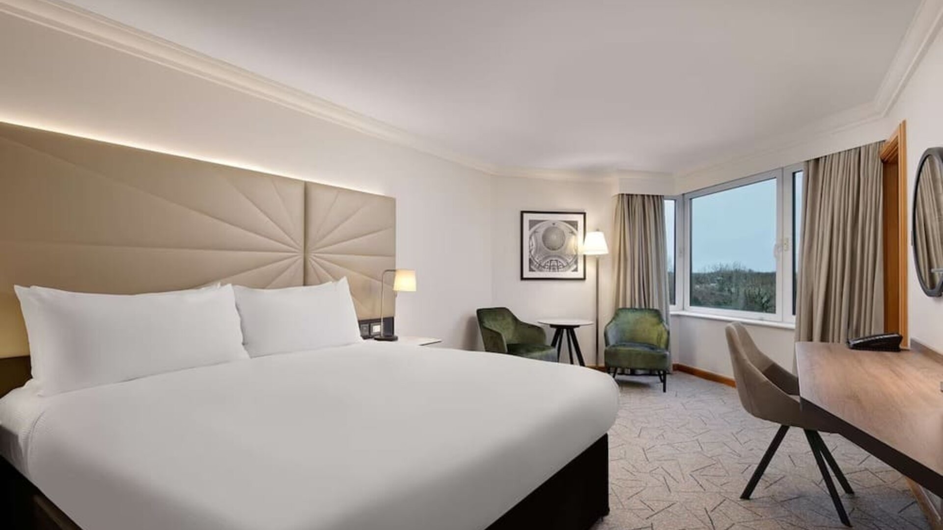 Day use guest room with view, work desk and lounge area at the Hilton Birmingham Metropole.
