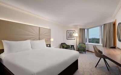 Day use guest room with view, work desk and lounge area at the Hilton Birmingham Metropole.