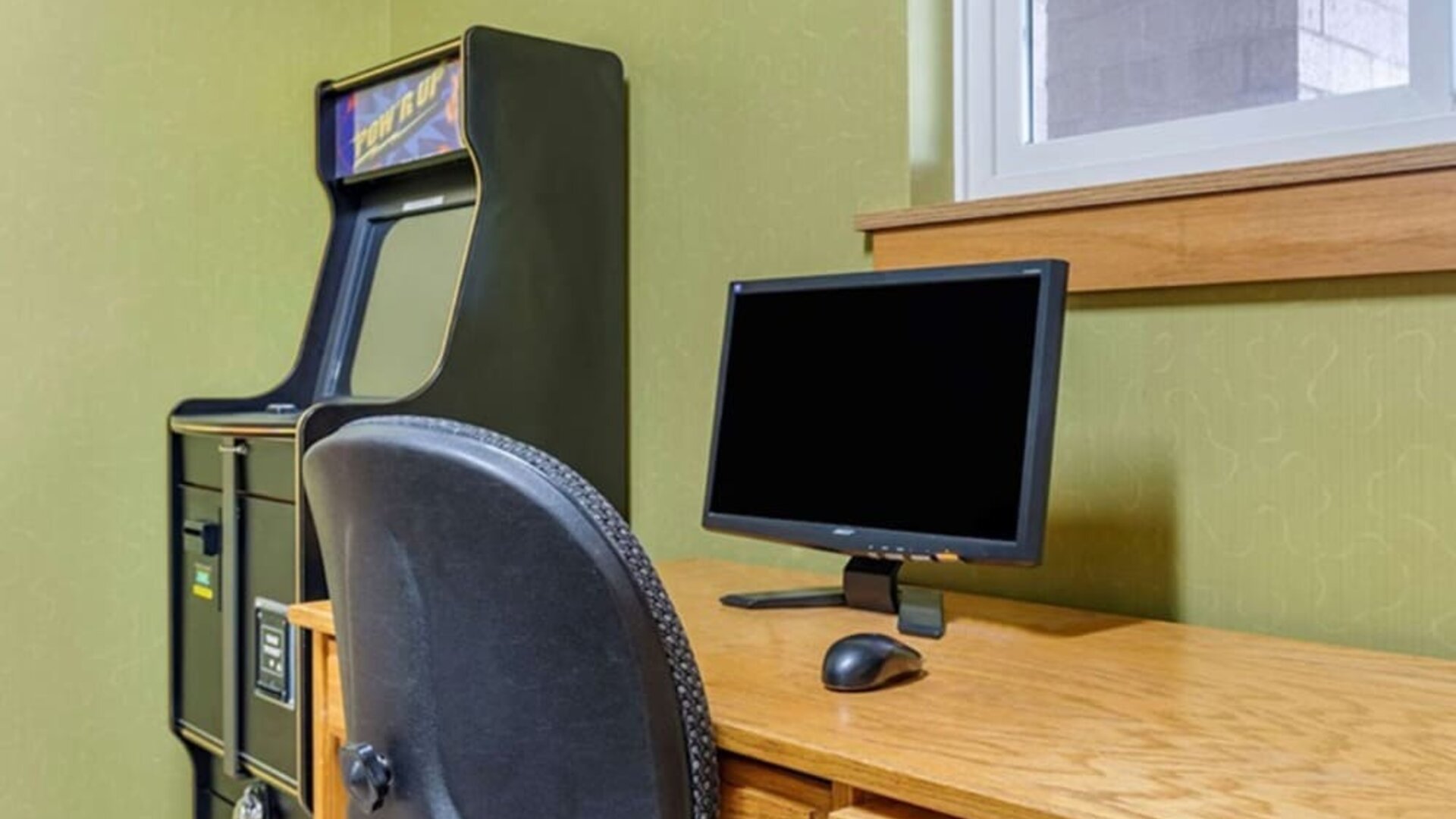 Work desk and ATM at Coratel Inn & Suites By Jasper River Falls.