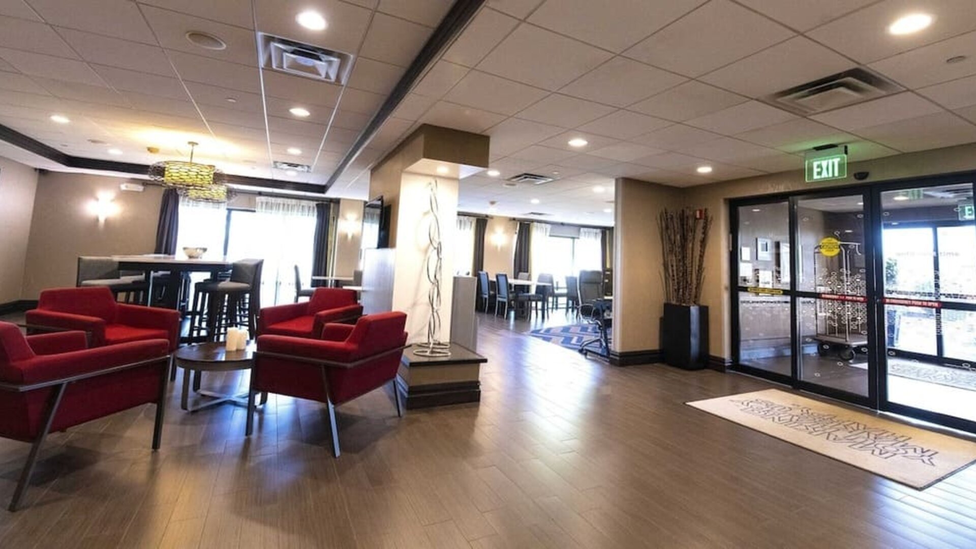 Inviting lobby lounge featuring comfortable seating, contemporary décor, and welcoming spaces to relax or socialize at Hampton Inn Ridgefield Park.