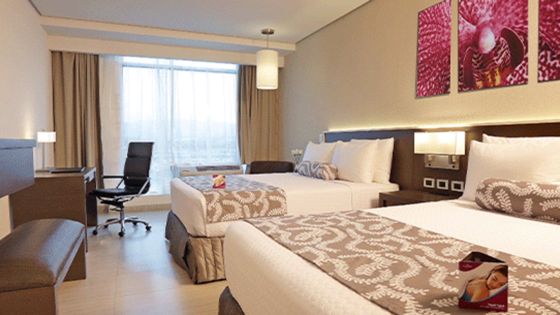 Bright and spacious double guest room featuring two beds, work-friendly amenities, and contemporary furnishings at Crowne Plaza Panama Airport.