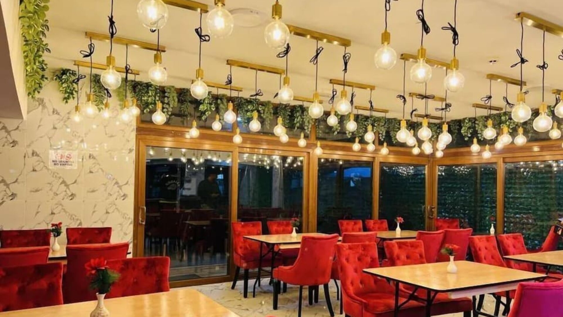 Dining area with stylish lighting, comfortable seating, and modern décor at Stay Inn Express.