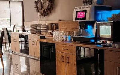 Self-service coffee station with Costa Coffee machine in the breakfast area at Hotel Seven.