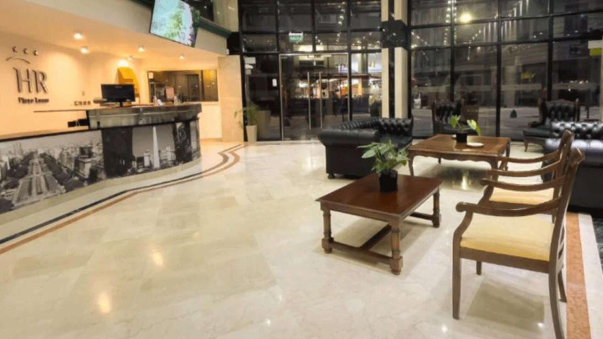 Spacious entrance lobby showcasing modern décor, comfortable seating arrangements, and easy access to the hotel's main facilities at HR Plaza Luxor.