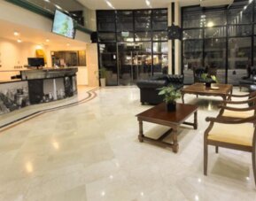 Spacious entrance lobby showcasing modern décor, comfortable seating arrangements, and easy access to the hotel's main facilities at HR Plaza Luxor.