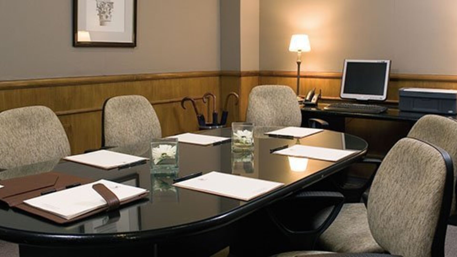 Private boardroom featuring executive seating, presentation facilities, and a professional setting for meetings and business discussions at Hotel Lafayette.