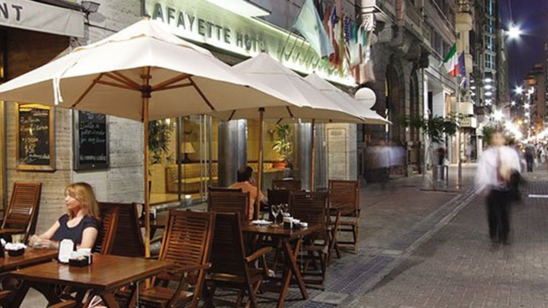 Outdoor café terrace at Hotel Lafayette overlooking a lively pedestrian street, offering al fresco dining in the heart of the city at Hotel Lafayette.