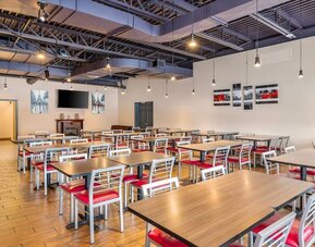 Bright breakfast dining area with comfortable seating and contemporary design at Comfort Inn Laval.